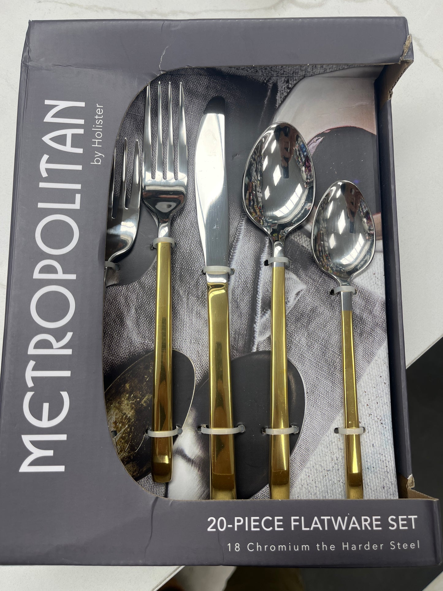 Metropolitan stainless steel 20 piece, flatware, gold silver