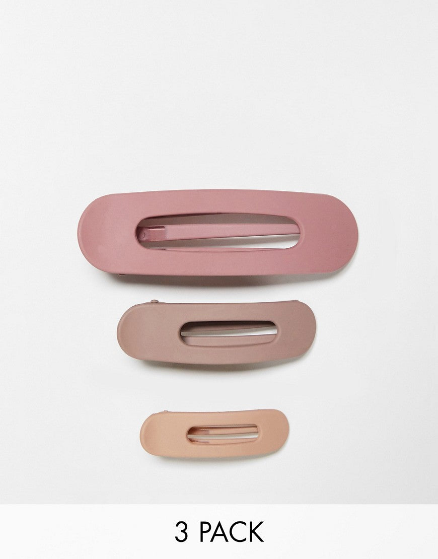 Kit. Sch flat lay claw hair clips