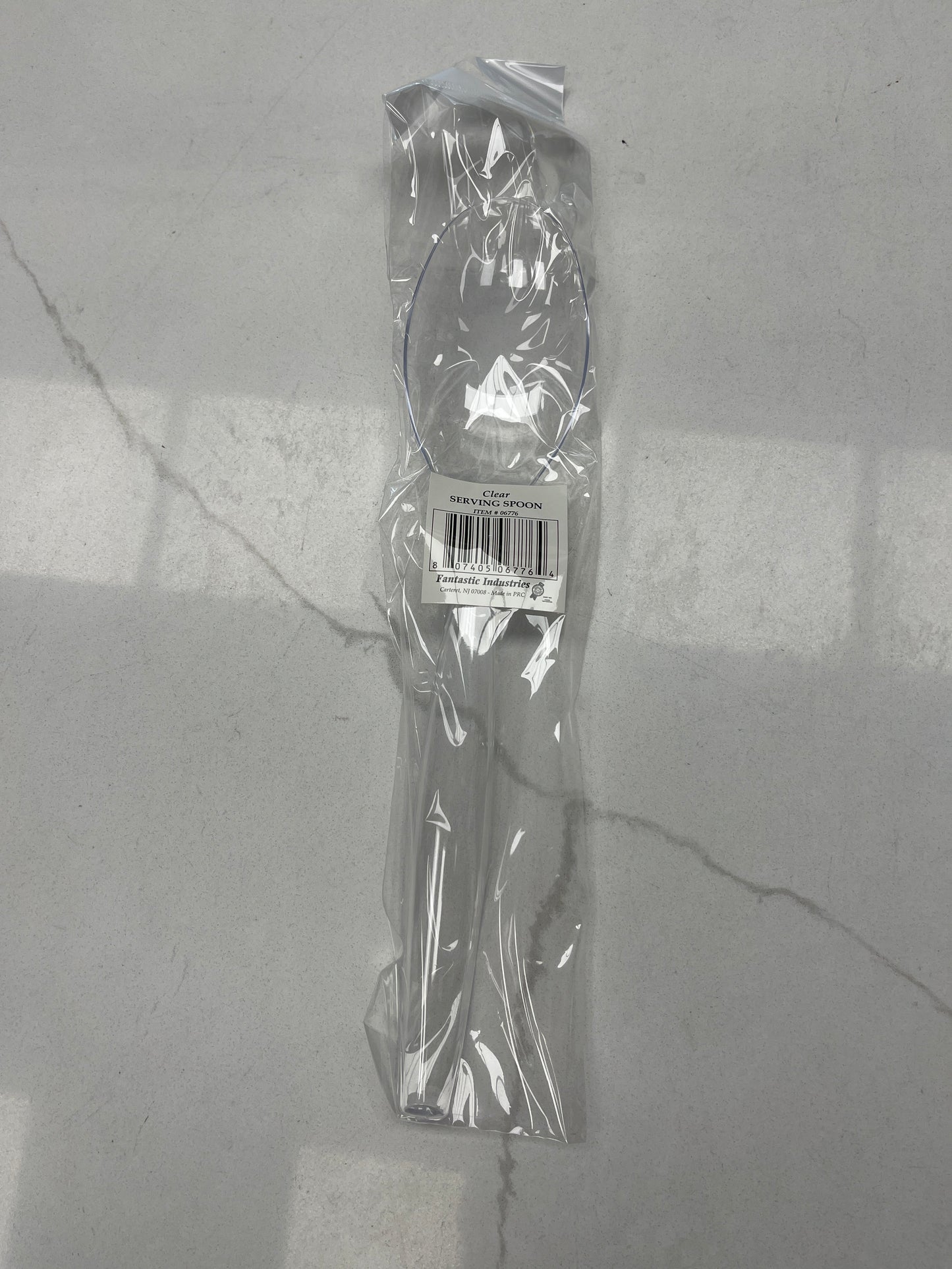 Clear plastic serving spoon